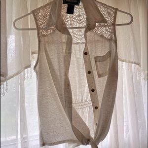 Cream color - tank top - front pocket - tied bow in front that Can be untied